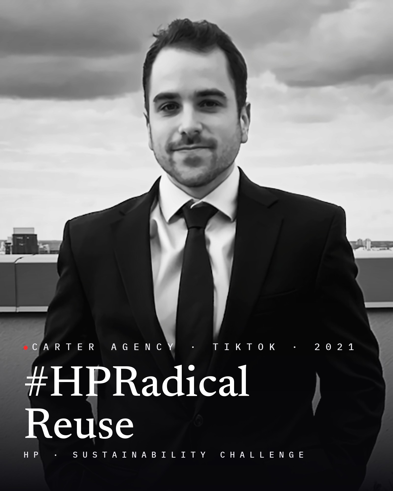 Josh Popkin, founder of Carter Agency, in a suit on a rooftop, black and white, with the title #HPRadicalReuse