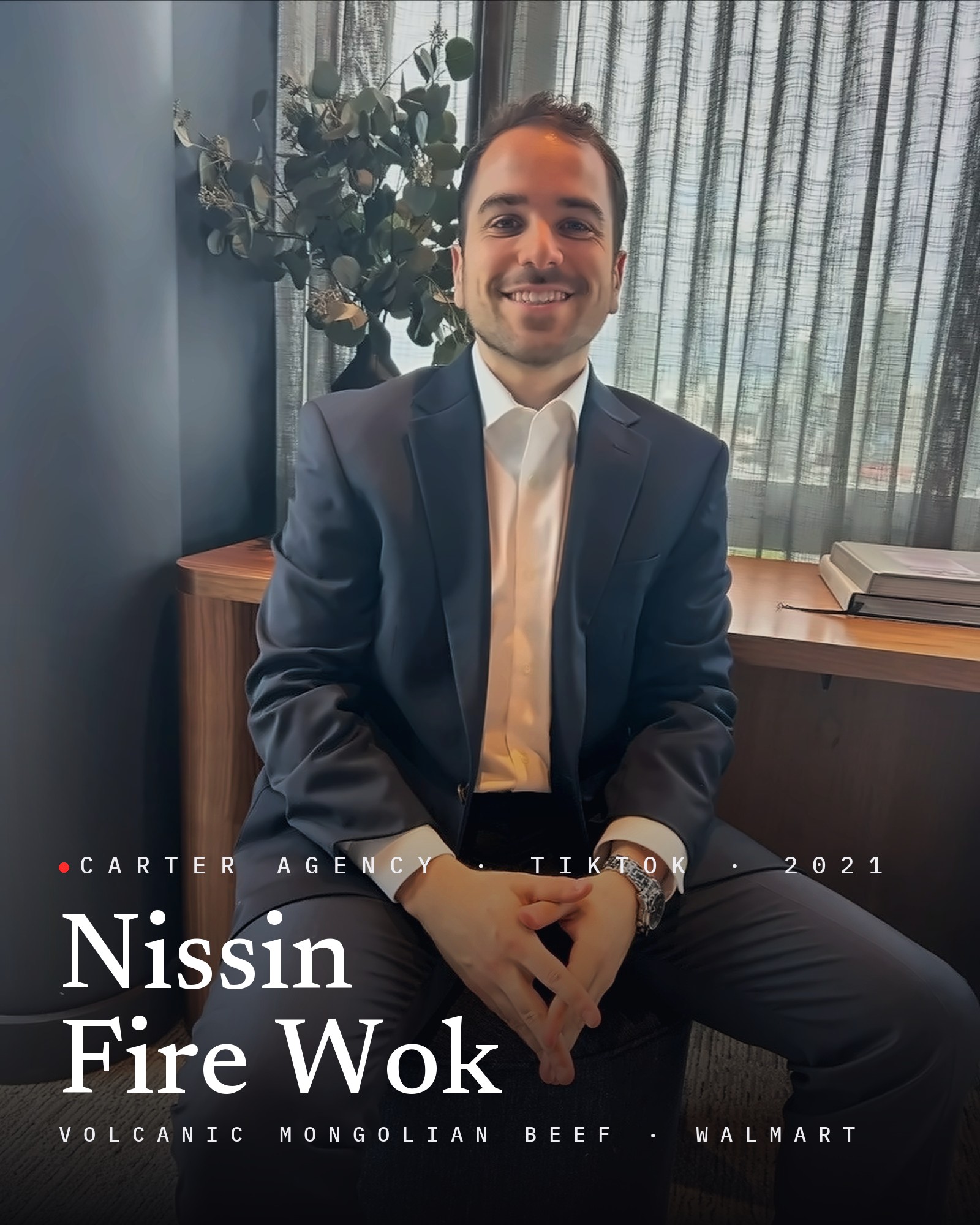 Josh Popkin, founder of Carter Agency, seated in a suit, with the title Nissin Fire Wok