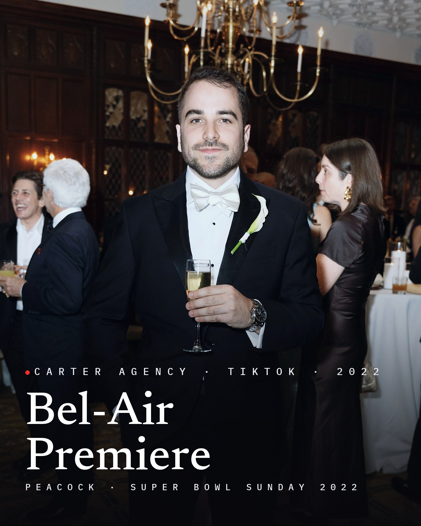Josh Popkin, founder of Carter Agency, in a tuxedo at an evening reception, with the title Bel-Air Premiere